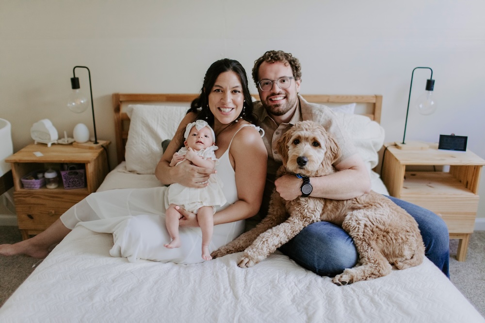 Lance Irick at home with his wife, daughter, and their dog Luna